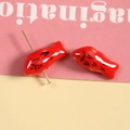 Macro detail of red 3D koi fish ceramic beads with golden pins for DIY handmade jewelry - Red