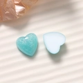Close-up of 16mm heart resin charms in glitter mint and smooth light blue for DIY crafts - Heart Shape (B76-1-1-7) / Blue