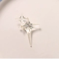 Macro shot of two transparent resin four-pointed star charms for jewelry making - Clear White