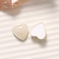 Macro shot of 16mm heart resin charms with glitter pearl and creamy white finish - Heart Shape (B76-1-1-7) / White