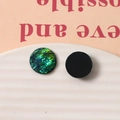 Detailed view of round iridescent resin charms with green and gold foil for DIY jewelry - Green Half Round