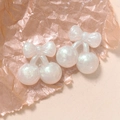 Detail of pearlescent pink cherry charms with glitter resin for DIY jewelry crafts - Cherry