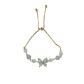 Adjustable golden bracelet with butterfly cat eye beads and zircon stones on white background - Gold