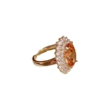Bague ajustable dorée luxueuse avec une pierre orange ovale et un halo de zircons - Bague ovale champagne