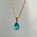 18k gold plated stainless steel necklace featuring a teardrop blue zircon pendant - March