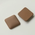 Close-up of matte brown square craft charms with rounded edges for DIY accessories - Coffee Square Style