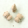 Detailed macro view of cute flocked cat charms for DIY jewelry and crafts in beige - Light Coffee Cat Charm Style