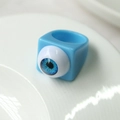 Macro shot of creative square resin ring featuring a realistic blue eyeball design - Blue