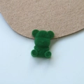 Detailed close-up of a green flocked teddy bear DIY acrylic charm for jewelry - Green