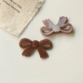 Macro view of brown flocked and grey-purple translucent bow DIY jewelry accessories - Dark Brown