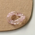Macro detail of acrylic chain links with pink ink-wash patterns on felt base - Pink