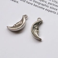 Pair of vintage silver crescent moon pendants with detailed facial carvings for DIY jewelry - Moon (One)