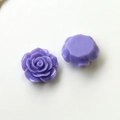 Detail of purple resin rose cabochon showing layered petals and flat back for DIY crafts - Purple