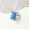 Detailed view of a blue flocked bear ring with a soft velvet texture on a white background - Sky Blue Bear