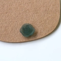 Macro detail of dark green matte resin rose charm with realistic frosted petal texture - Grey Green