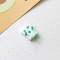 Detail view of 3D panda rabbit mahjong doll resin cabochon with green dot pattern - Robot Monster Style 2 / White with Emerald Limbs