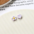 Macro view of light purple resin flower charms with yellow center for DIY crafts - Taro Purple