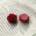 Macro detail of red flocked rose flower charms with velvet texture for DIY jewelry making - Rose