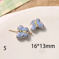 Vue macro d'une perle papillon en céramique peinte à la main pour création de bijoux DIY - Style Bleu Ciel et Jaune (88#5)