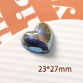 Macro view of blue laser faceted heart resin accessory on white tray, 23x27mm - Large Heart Style / 1 Piece / Fantasy Blue