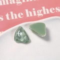 Macro shot of green translucent resin triangular charms for DIY earring making - Green