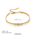 Vintage 18k vergulde roestvrijstalen armband met drie heldere zirkoonstenen - Armband 17+3cm / Goud