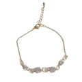 Elegant gold chain bracelet with round cat eye stones and sparkling zircons for women - Gold