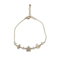 Elegant gold-tone star and moon link bracelet with shimmering pavé crystal accents - Rhinestone Star Moon (Gold) / Gold