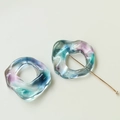 Close-up of translucent colorful marble resin rings and gold T-pin for DIY jewelry - Irregular Smudged Hollow Ring