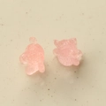 Detail of two cute pink resin gummy bear charms with textured jelly surface for DIY - Pink