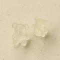 Macro detail of transparent resin bear charms with textured finish for DIY jewelry crafts - Clear White