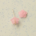 Close-up of pink frosted resin bellflower charms for DIY jewelry making and crafts - Pink
