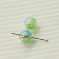 Detailed macro view of 16mm gradient stripe glass beads with golden T-pin for DIY jewelry - Blue And Green Swirl Style (44#5)