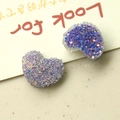 Macro detail of purple glitter resin heart charms for DIY jewelry and hair accessories - Purple