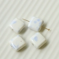 Close-up of square ceramic beads with light blue ink splash pattern and through-hole - Blue (111#)