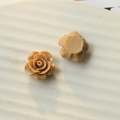 Macro detail of caramel resin rose DIY charm showing the front petals and flat back - Coffee