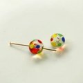 Detailed macro view of two rainbow polka dot glass beads with a gold metal pin accessory - Colorful Polka Dot Lampwork Bead (22)