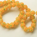 Macro shot of vibrant orange glass flower beads with yellow petals for DIY jewelry making - 1 Piece/Pack / Orange