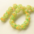 Green glass beads with embossed floral patterns for DIY jewelry and accessory crafting - 1 Piece/Pack / Verdant