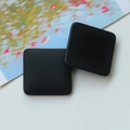 Detail of matte black square resin charms with a smooth frosted finish for DIY jewelry - Black Square