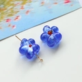 Macro shot of handmade blue glass flower bead with red core for DIY jewelry making - 1 Piece / Blue