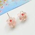 Detailed macro shot of pink glass flower beads for DIY jewelry with gold metal pins - 1 Piece / Pink