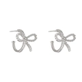 Silver bow hoop earrings with white faux pearl embellishments and elegant design - Pearl Bow Hoop Earrings / Silver
