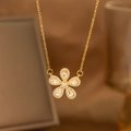 Detailed view of a gold floral pendant necklace set with five teardrop-shaped zircons - Five-Petal Flower Style (9165)