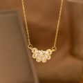 Macro detail of gold laurel wheat leaf pendant necklace with shimmering white zircon - Half Zirconia Flower Butterfly (9180)
