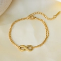Elegante bracciale a doppia catena dorata con simbolo dell'infinito e chiusura regolabile - Braccialetto Figura 8 (E110) / Oro