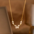 Close-up of golden laurel leaf necklace with butterfly shaped zircon stones on O-chain - Butterfly V-Array Zirconia (9185)
