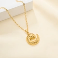 Detail view of gold spiral swirl pendant with paperclip chain on soft beige background - Spiral Horn Pendant Style