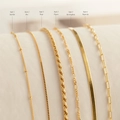 Detailansicht von sechs goldenen 18K Edelstahlketten inkl. Figaro- und Seilketten - Satellitenkette-Stil(Style 1)