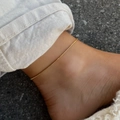 Detail of 18K gold-plated stainless steel box chain anklet worn on female ankle - Box Chain Anklet